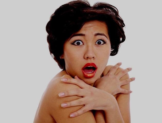 Shocked asian young woman closeup