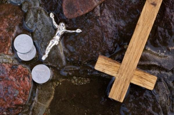 Cross, coins and Jesus figure.