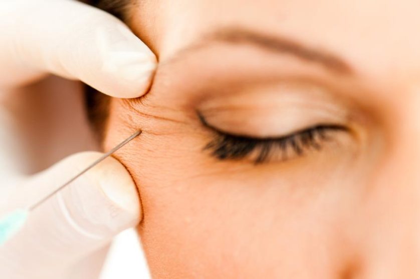 Macro closeup of botox injection near eye