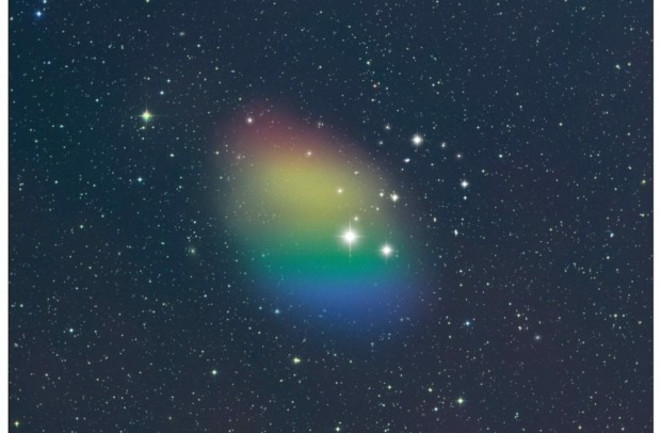 As cores nesta imagem representam a interpretação artística da rotação do hidrogênio na galáxia J0613+52, conforme detectado pelo Telescópio Green Bank. O vermelho indica o gás que se move para longe de nós, enquanto o azul representa o gás que se move em nossa direção. Crédito: STScI POSS-II com ilustração adicional por NSF/GBO/P.Vostee.